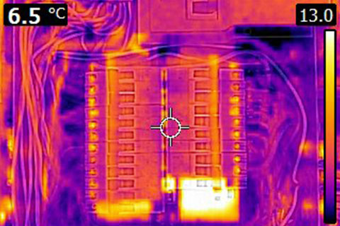 Home Inspector Oakville a thermal image picture of an electrical panel showing the types of defects a home inspector can detect with a  thermal imager that you can not see with the naked eye